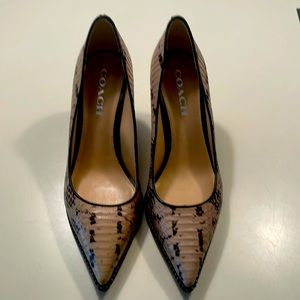 Tan and black Coach pumps.